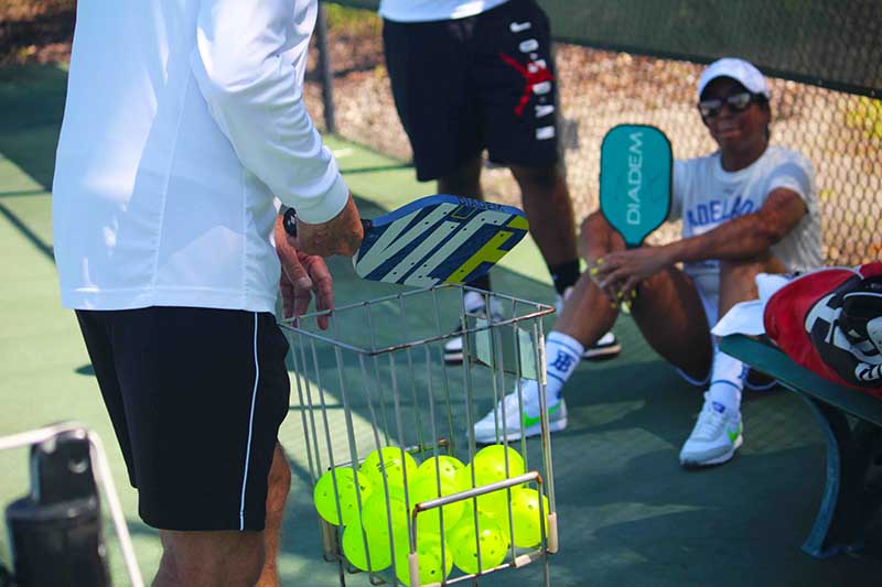 couple playing pickleball